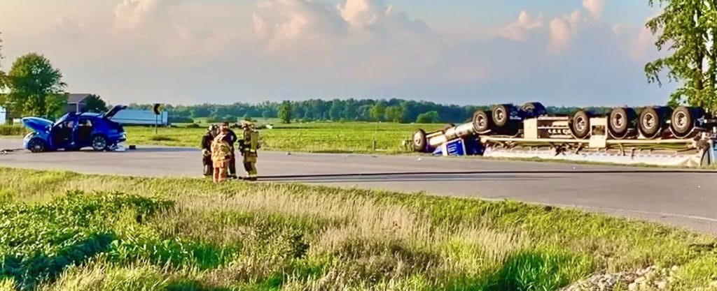 Woman dead, two injured after crash between SUV, tractor trailer