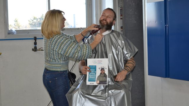 The CSN garage becomes a barber shop as Devin Heuser says goodbye to his beard for charity on Dec. 21, 2022. (Emily Bowen photo)
