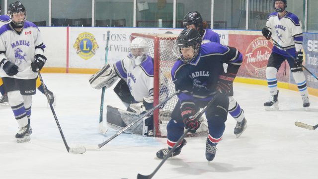 F.E. Madill Secondary School’s soon-to-be graduates took on members of the school’s staff in a fun hockey game last week at the North Huron Wescast Community Complex. Above: a staff member makes a break out of the defensive zone. (Denny Scott photo)