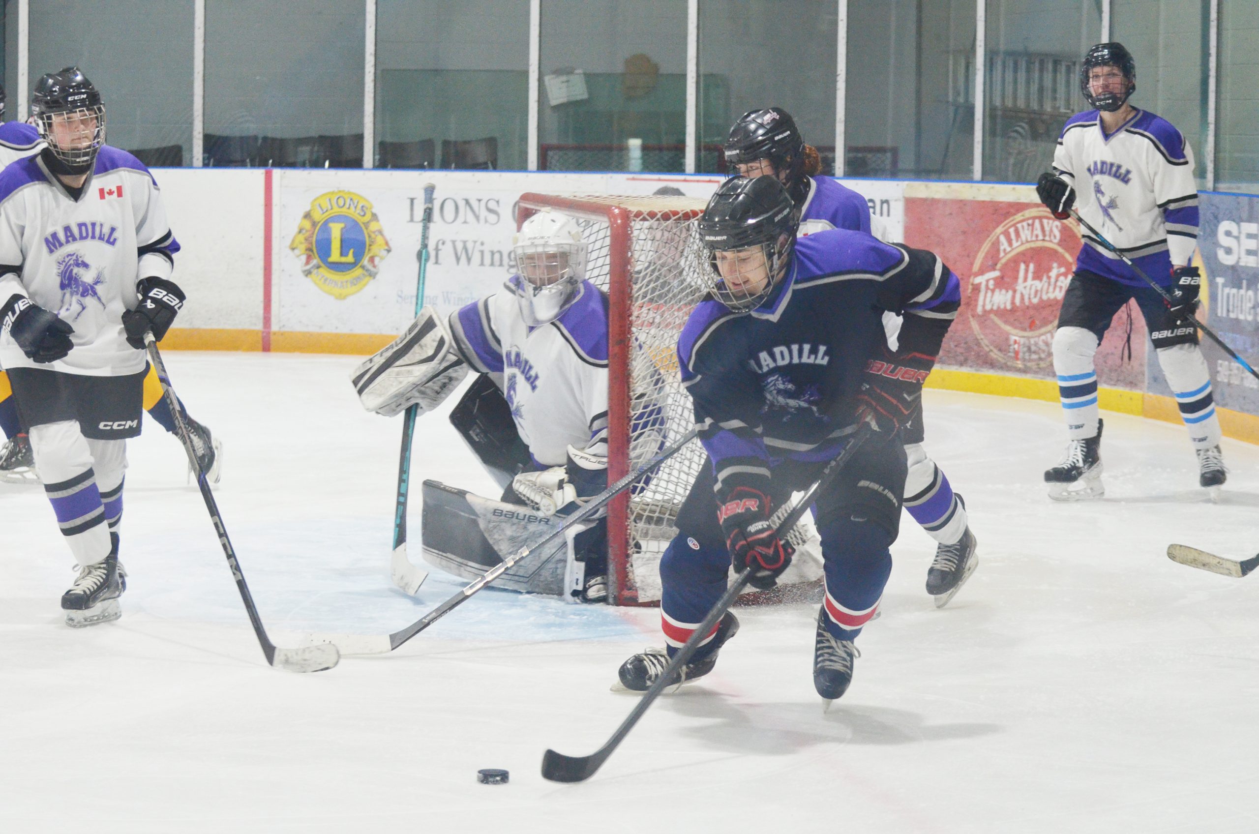 F.E. Madill Secondary School’s soon-to-be graduates took on members of the school’s staff in a fun hockey game last week at the North Huron Wescast Community Complex. Above: a staff member makes a break out of the defensive zone. (Denny Scott photo)